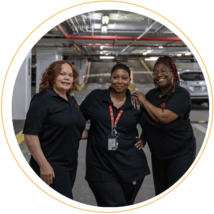 Three SP+ employees in parking garage