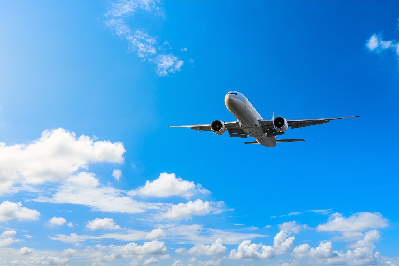 airplane flying in the blue sky